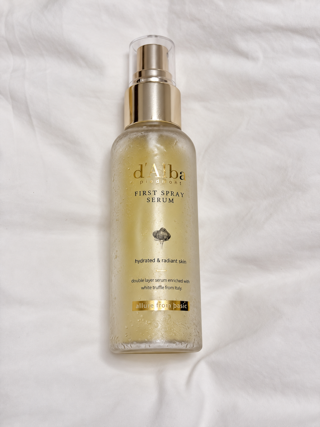 d'Alba First Spray Serum on white fabric