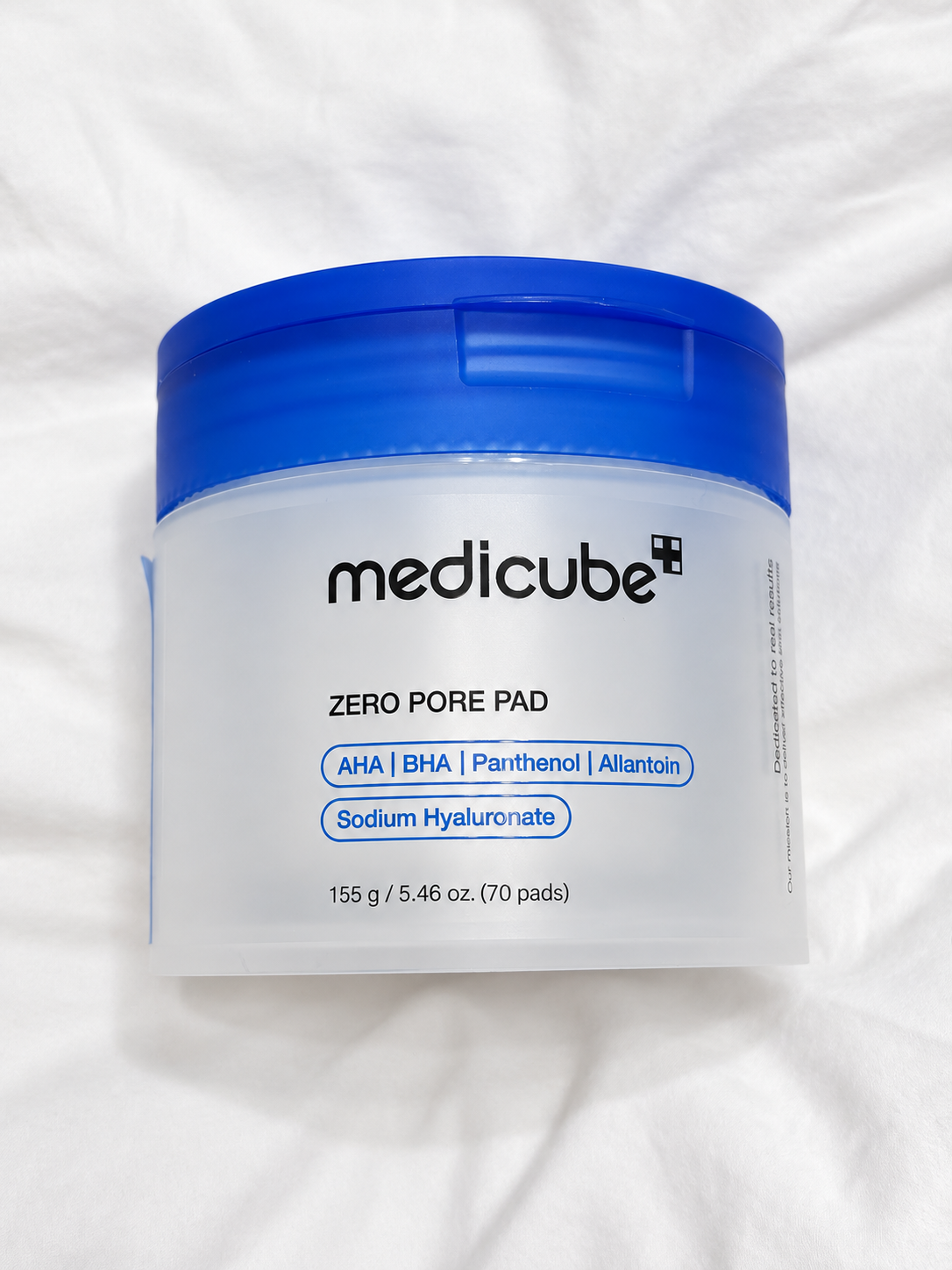 Medicube Zero Pore Pad on white fabric