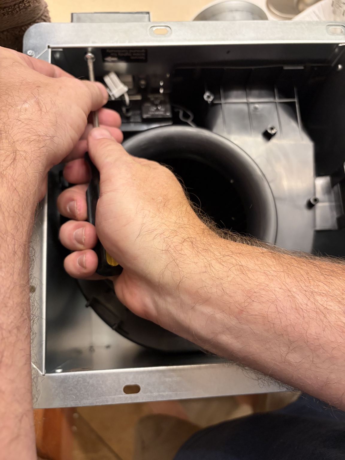 Preparing the Panasonic bathroom fan housing before installation