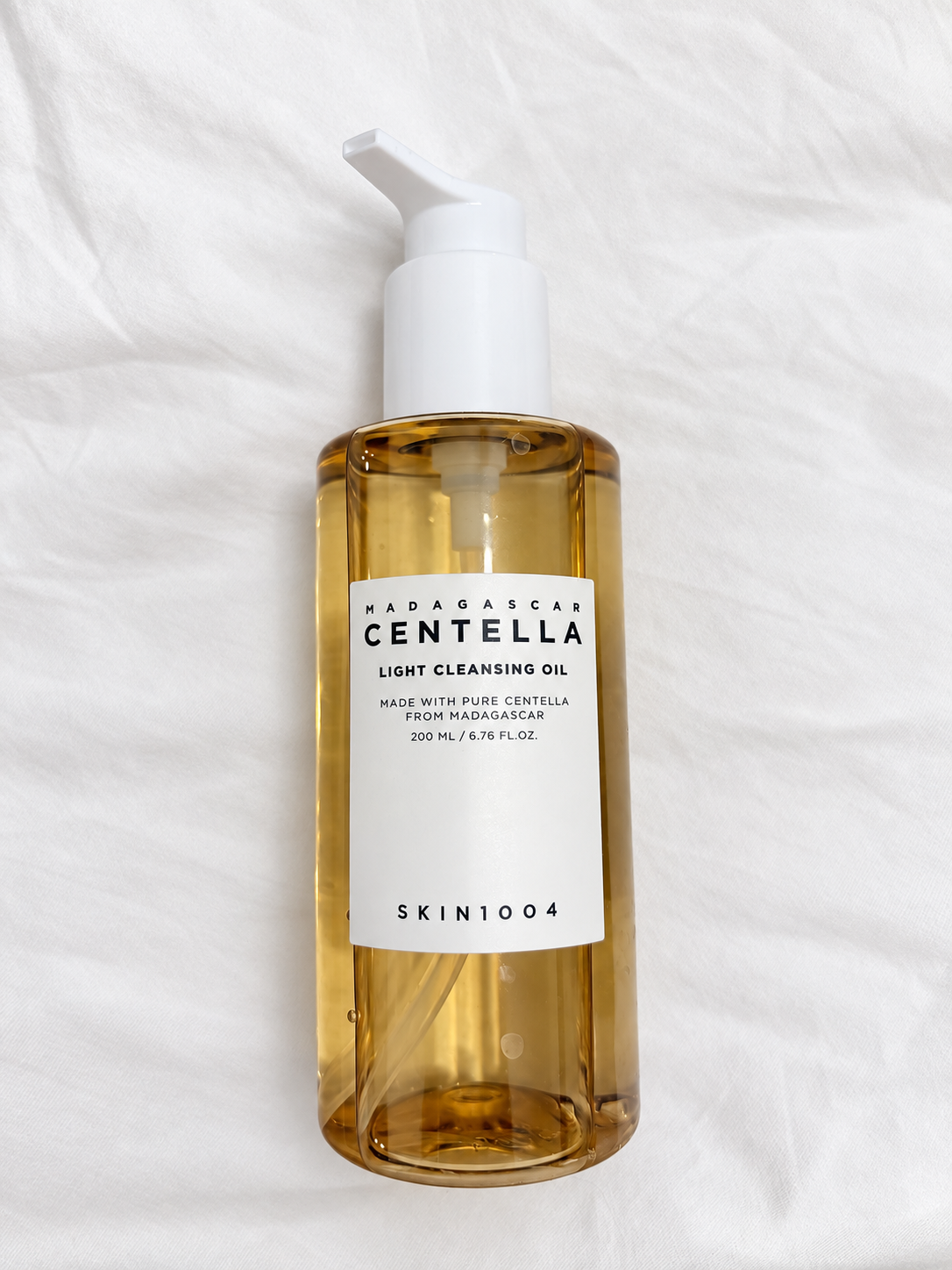 SKIN1004 Madagascar Centella Light Cleansing Oil on white fabric